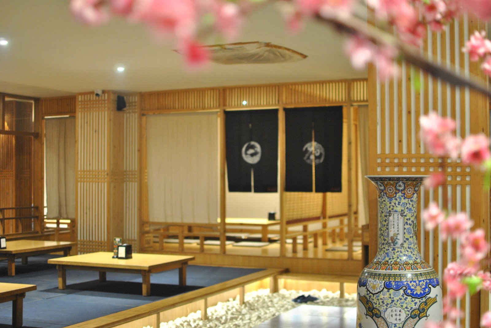 Floor seating with blossoms and porcelain vase