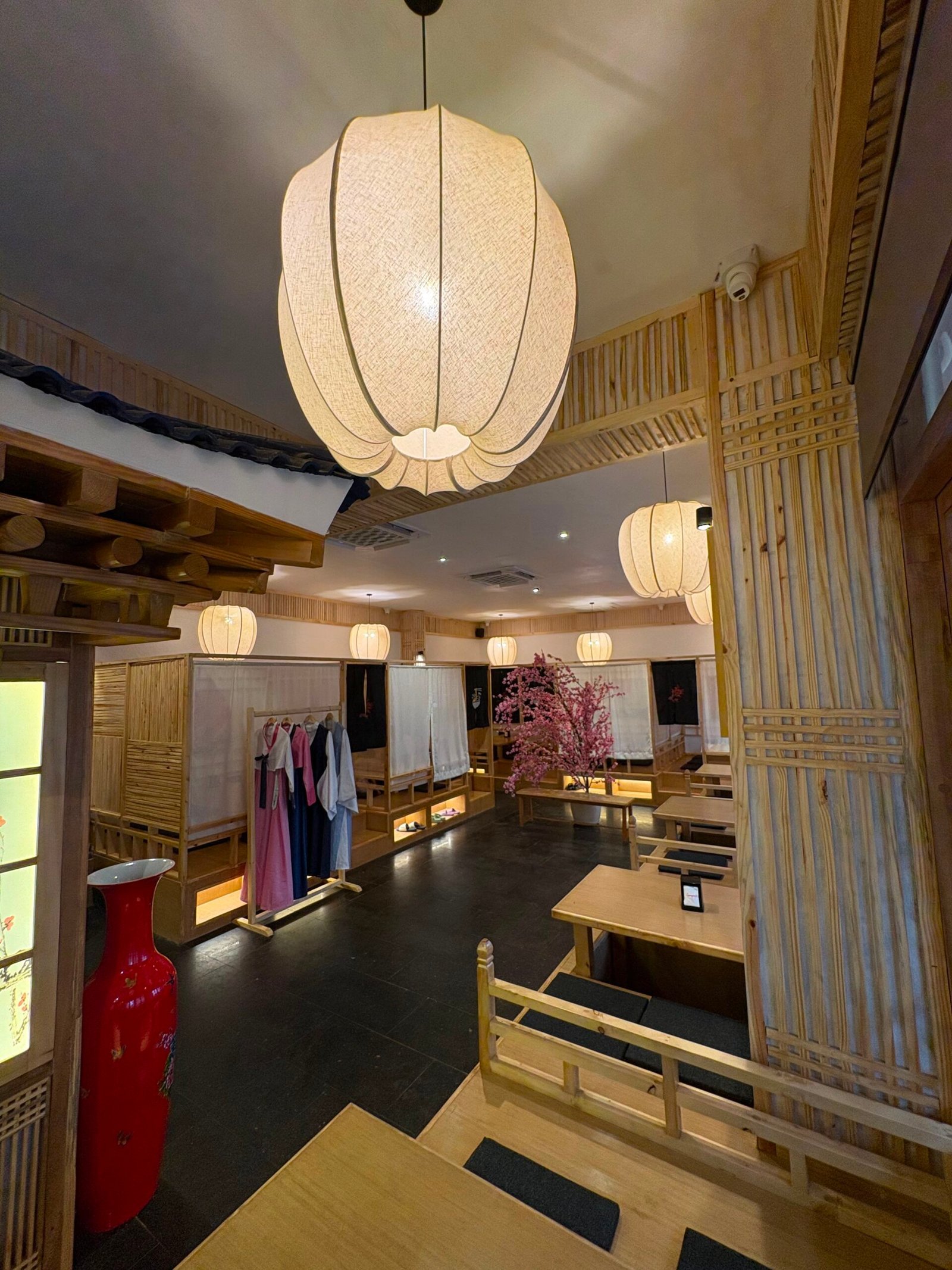 Lantern-lit dining room with hanbok